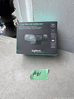 Photo of Logitech C920S Pro HD Webcam box showing product branding and features