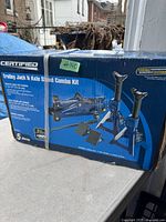 Box of Certified Trolley Jack & Axle Stand Combo Kit showing image of contents