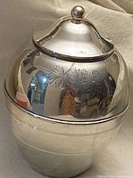 Full view of the vintage silver decanter with domed lid, clearly showing the rounded shape and lid knob.