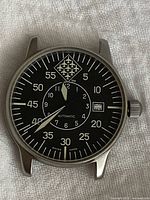 Front view of watch showing dial and stainless steel case