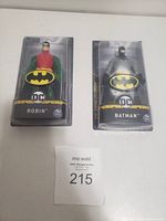 Photo shows two DC Charters action figures in blister pack: Batman and Robin; both brand-new in plastic packaging with DC and bat logos on cards.