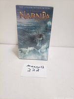 Front view of sealed box set for The Chronicles of Narnia book series with characters from the movie on the cover.