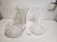 Full set of three white crystal items including the vase, bowl, and dish photographed together on white surface