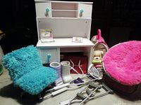 Wide view showing desk, chairs, pet dog with carrier, boot casts, and crutches