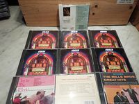 Eleven assorted oldies music CDs, including six featuring jukebox cover art from years 1945, 1949, 1950, 1951, 1952, 1953, and five additional CDs with various artists and titles.