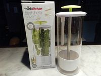 thinkkitchen fresh herb saver with box and herbs inside, showing overall design and packaging