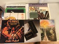 Overview of 9 vinyl LP albums stacked side by side showing front covers including Climax Blues Band Gold Plated, Boomtow Rats V Deep, Moody Blues album, Al Stewart Year of the Cat, Outlaws, and more.