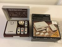 Philips International Travel Kit in case with converter and 5 adapters, box shown next to case