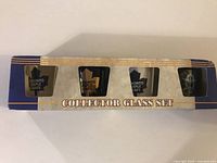 Full unopened box of 4 Toronto Maple Leafs shot glasses in official NHL licensed packaging