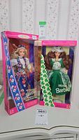 Photo showing the two Barbie dolls in their original boxes, Norwegian Barbie on the left and Irish Barbie on the right, both new in box.