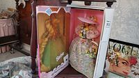 Full view of Rapunzel Barbie and Seasons Collection Barbie in original packaging