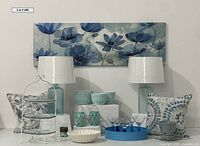 Full lot overview with artwork, lamps, pillows, tableware, and decor items arranged together