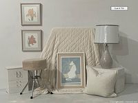 Full lot items arranged including framed artworks, jewelry box, stool, lamp, pillow, and blanket