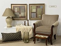 Complete set of Bombay Company chair, footstool, artworks, lamp, candlesticks, glass vessel, textiles shown in room setup
