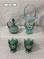 Full lot view showing cruet, basket, and two candle holders arranged on polka dot background.