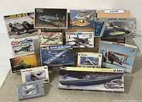 Overview photo of all model kits stacked together showing box art and variety of models included