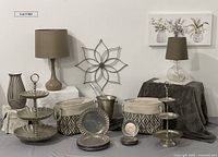 Photo of the whole lot showing lamp, vase, servers, plates, canvas bags, metal wall flower, and other accessories