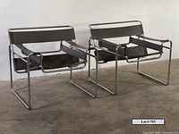 Pair of chairs facing camera at slight angle