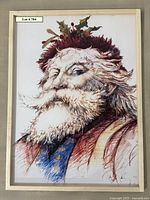 Photo of lithograph print in a white frame showing Saint Nicholas portrait with holly decoration in hair.