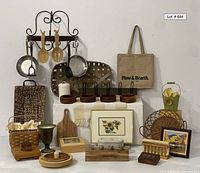 Full lot showing all kitchen and home items including rug, pot rack with utensils, baskets, artwork, and various tablewares.