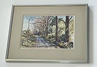 Full view of the framed painting showing the country lane scene with trees