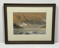 Framed watercolour painting showing the full lake and mountain landscape with muted earthy colors and soft clouds or mist.