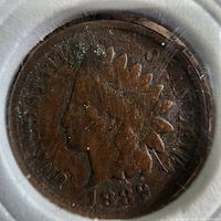 Obverse side of the 1889 Indian Head penny coin showing the Native American profile and date.
