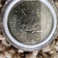 Close-up photo of a 1979 USA fifty cent coin showing detailed profile and inscriptions.