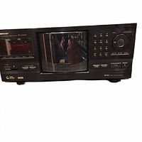 Front view of Pioneer PD-F1009 multi-disc CD player showing control buttons, central CD compartment, and display panel.