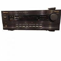 Front view of Pioneer VSX-D209 multi-channel receiver showing button controls, display screen, and large volume knob.