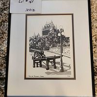 Photo showing framed print of cannon and lamppost scene with castle background, signed Vogel