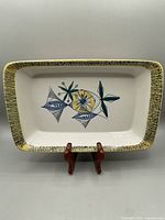 Front view of the rectangular ceramic oven dish with the Flamingo Bambus design and yellow-green textured rim.