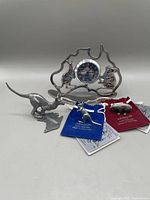 Photo of Australian quartz clock with kangaroo and koala figures and 3 pewter animal miniatures