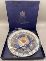 8-inch round Millennium plate in original Royal Worcester box, sealed in plastic.