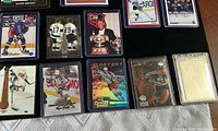 Top view of rows of Wayne Gretzky hockey cards showing various card designs and players wearing different uniforms in action and pose shots