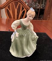 Front view of Royal Doulton Fair Maiden figurine in green dress