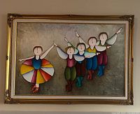 Full view of framed painting showing the ballerina and four folk dancers in colorful traditional attire, with some frame wear visible.