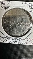 Close-up image of the 1867-1982 Canadian Confederation Constitution silver dollar coin showing detailed historic assembly scene.