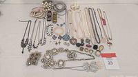 Overhead view of all jewelry items on white surface