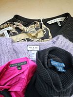 Labels on garments: Trina Turk, Paul & Joe, Ralph Lauren