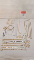 Overall layout of jewelry pieces on white cloth