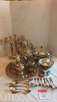 Overall grouping of tray, tea and coffee set, candelabras, bowl and flatware