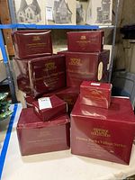 Nine maroon boxes stacked showing entire lot