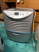 Front view of LG humidifier showing vents and control panel