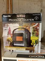Photo showing Dyna-Glo Tag-A-Long Portable Propane Heater in original box with model number RMC-8001SS, details and features visible