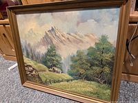 Framed signed mountain landscape painting showing full artwork and frame.
