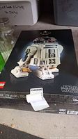 Front of sealed box showing R2-D2 model and Star Wars logo