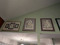 Three framed New Orleans-themed prints hanging on a wall, showing placement and size.