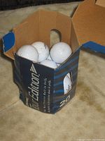 Open Tour Edition box containing 15 white golf balls