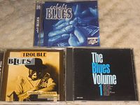 Front covers of all three blues compilation CDs